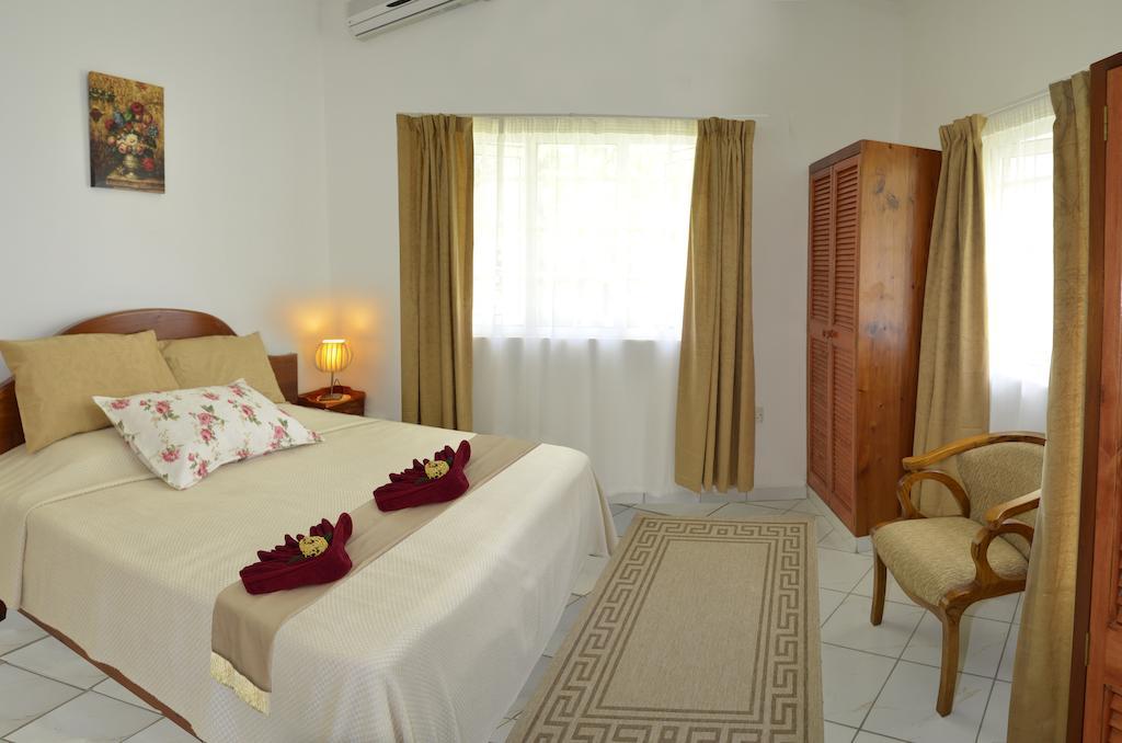 Ixora Villa Anse Royale Rum bild